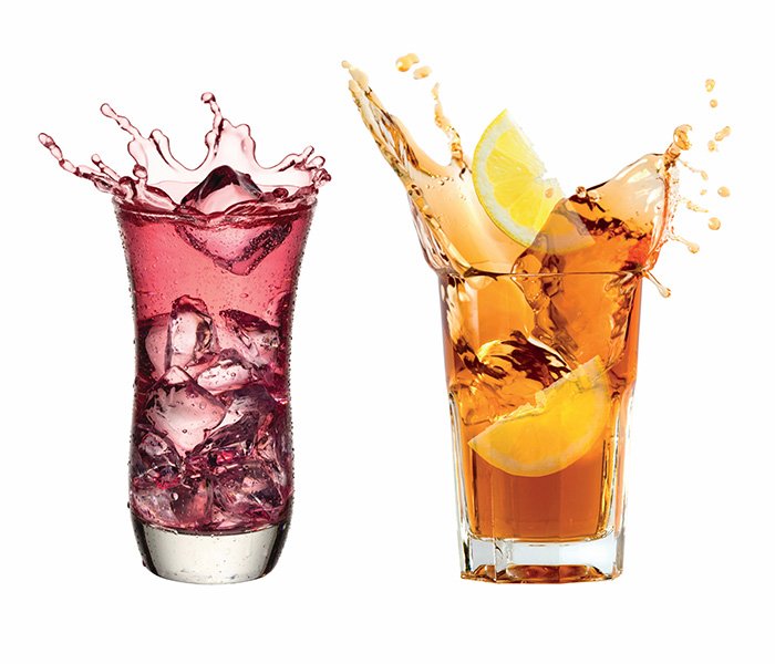 Two glasses containing red and orange beverages