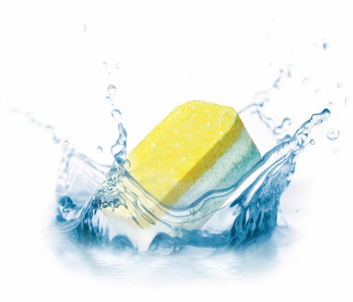 A detergent tab splashing in water