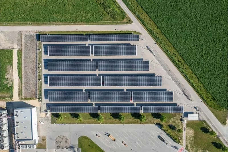 This is an aerial photo of rows of solar panels.