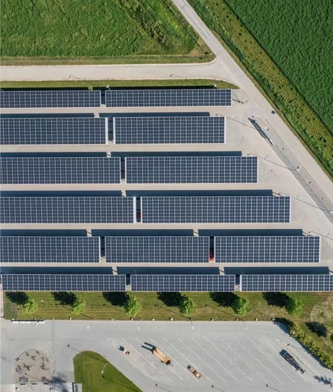 This is an aerial photo of rows of solar panels.